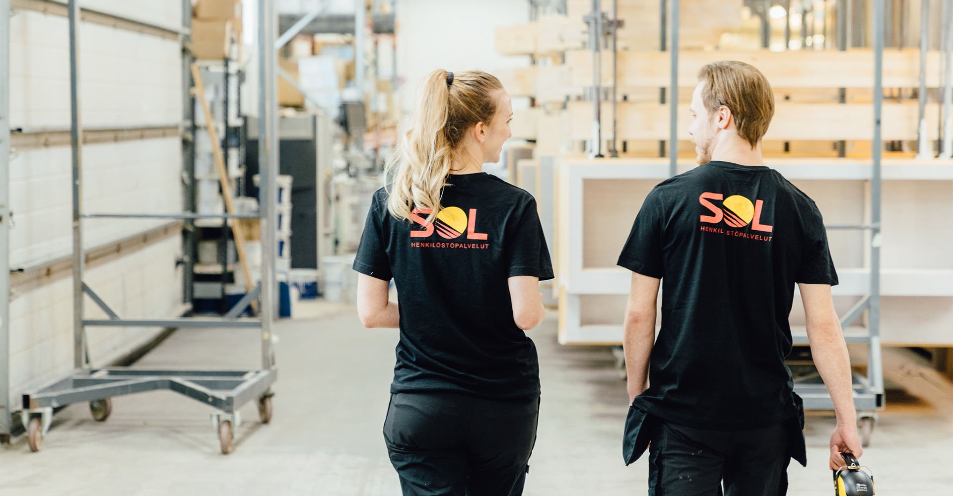 two SOL employees walking forwards together